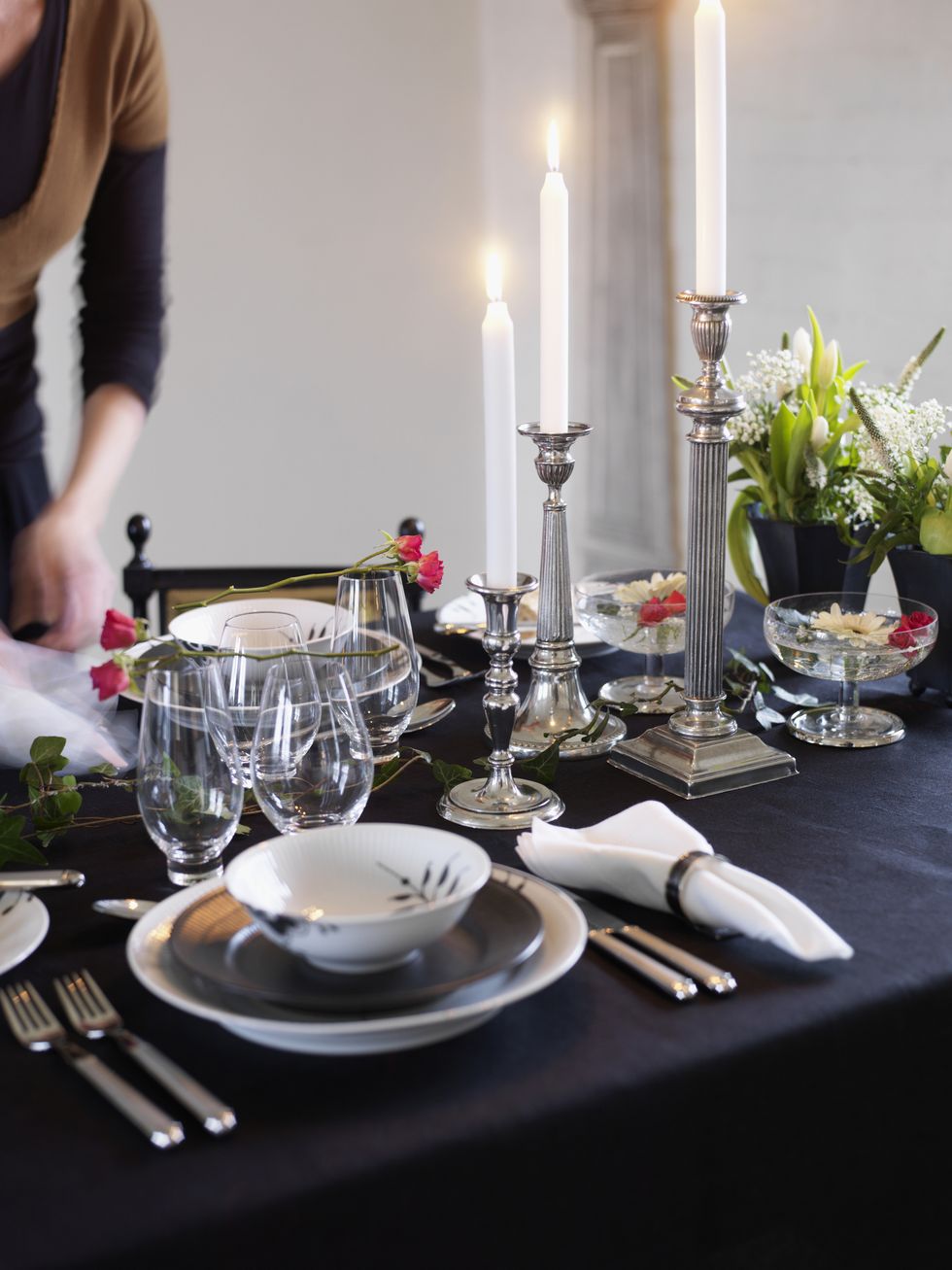 Dining table arrangement by woman