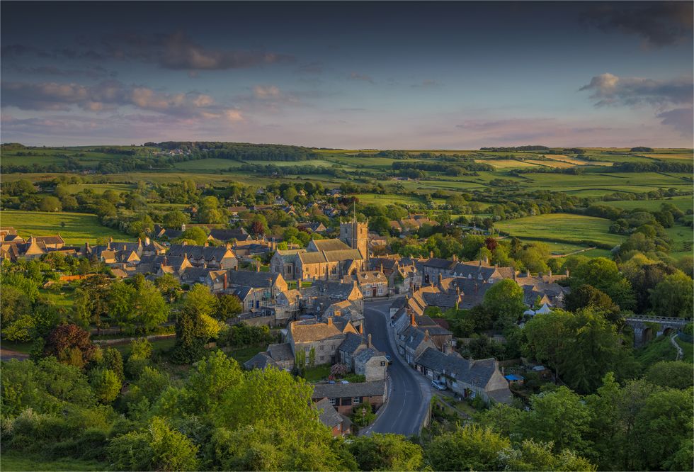 An overview of the beautiful small village of Corfe on the Isle of Purbeck in warm evening light. Dorset England.