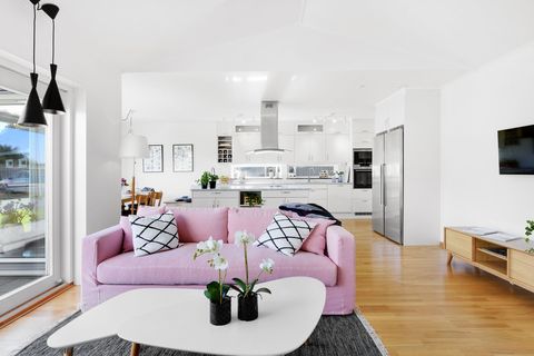 Interior of modern living room with pink sofa