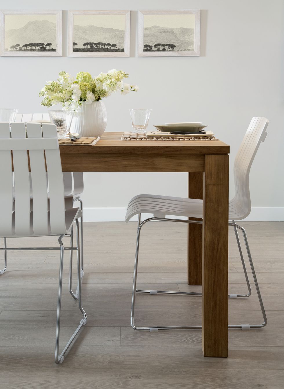 White chairs at wooden dining table