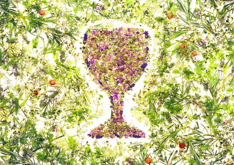Wine glass made up of herbs and flowers