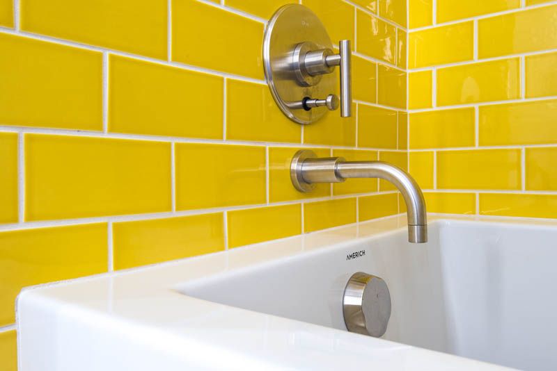 Tile, Tap, Wall, Yellow, Bathroom, Bathroom accessory, Plumbing fixture, Room, Shower bar, Line, 