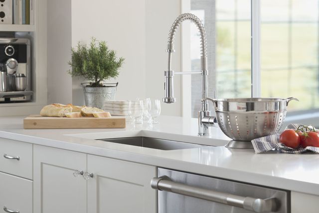 Gooseneck spring faucet in domestic kitchen