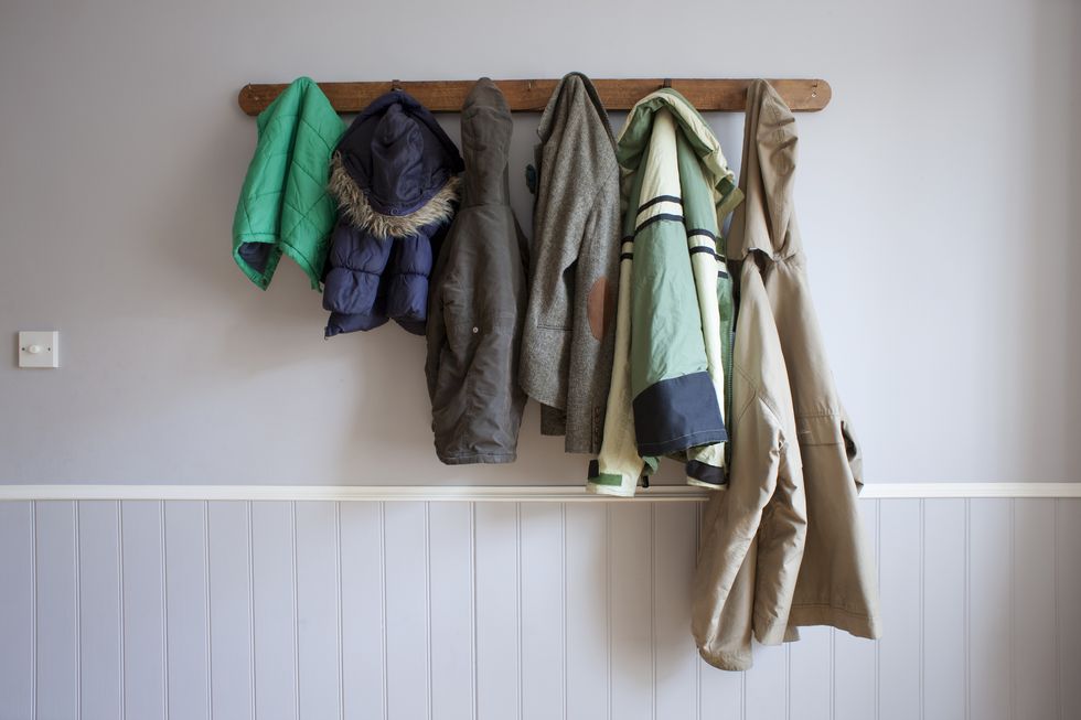 Coats hanging on coat rack
