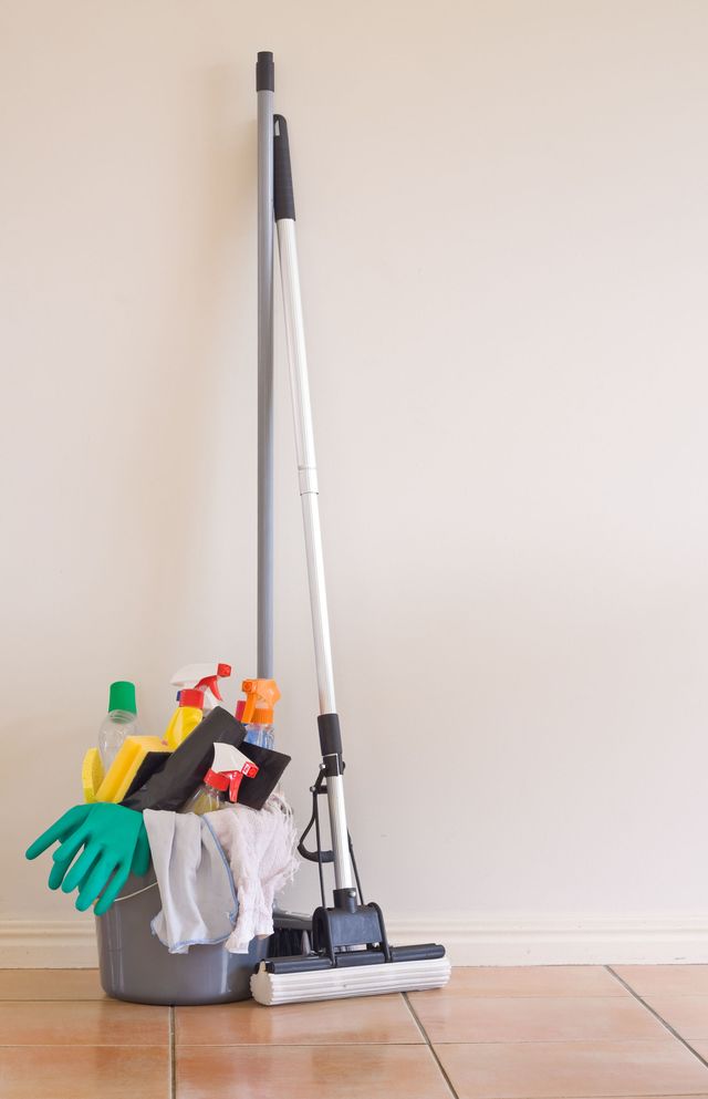 Cleaning equipment against a wall