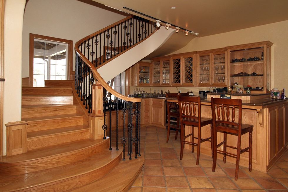 Property, Room, Wood flooring, Hardwood, Stairs, Building, Floor, Furniture, Wood, Interior design, 