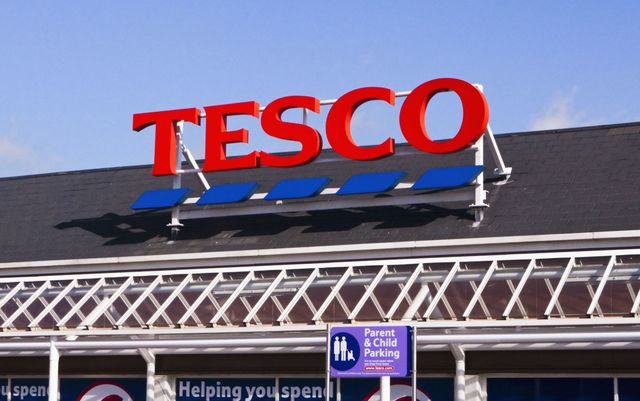 Exterior and logo of a UK Tesco supermarket, England, UK