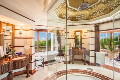 <p>Being able to see one of the most famous, iconic and impressive buildings in the world isn't something you get every day now, is it? Well, at the <a href="https://www.booking.com/hotel/in/the-oberoi-amarvilas-agra.en-gb.html?label=gen173nr-1DCAEoggJCAlhYSDNiBW5vcmVmaFCIAQGYAS64AQbIAQzYAQPoAQGSAgF5qAID;sid=3a2a3416e89e08236fe2947256c10124;all_sr_blocks=7880102_98580120_0_0_0;checkin=2017-11-27;checkout=2017-11-28;dest_id=-2088244;dest_type=city;dist=0;group_adults=2;hapos=1;highlighted_blocks=7880102_98580120_0_0_0;hpos=1;room1=A%2CA;sb_price_type=total;srepoch=1510055857;srfid=a45563eefeb3a0153ec2cca43da6a831e493dc51X1;srpvid=226154189e150595;type=total;ucfs=1&amp;#hotelTmpl" data-href="https://www.booking.com/hotel/in/the-oberoi-amarvilas-agra.en-gb.html?label=gen173nr-1DCAEoggJCAlhYSDNiBW5vcmVmaFCIAQGYAS64AQbIAQzYAQPoAQGSAgF5qAID;sid=3a2a3416e89e08236fe2947256c10124;all_sr_blocks=7880102_98580120_0_0_0;checkin=2017-11-27;checkout=2017-11-28;dest_id=-2088244;dest_type=city;dist=0;group_adults=2;hapos=1;highlighted_blocks=7880102_98580120_0_0_0;hpos=1;room1=A%2CA;sb_price_type=total;srepoch=1510055857;srfid=a45563eefeb3a0153ec2cca43da6a831e493dc51X1;srpvid=226154189e150595;type=total;ucfs=1&amp;#hotelTmpl" target="_blank">Oberoi Amarvilas hotel in the city of Agra</a> there's a bath with direct views of the Taj Mahal. Incredible.</p>