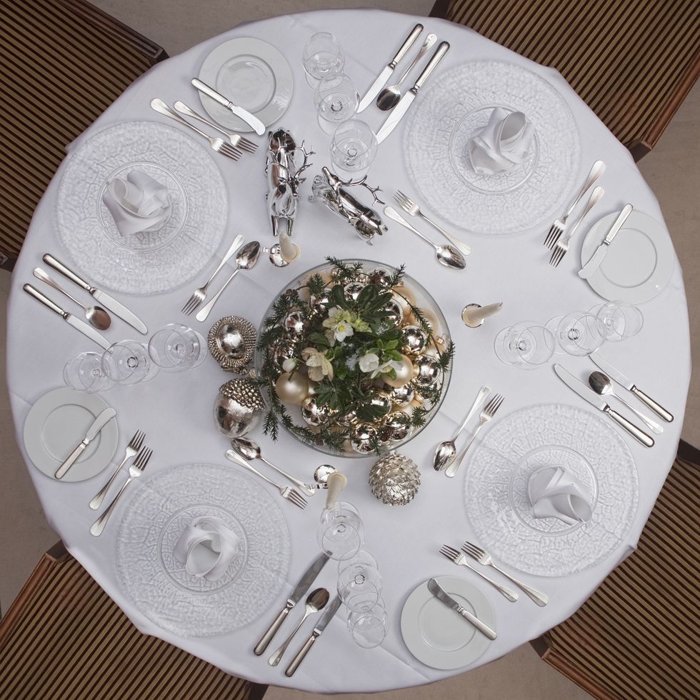 A table set for a formal dinner for four