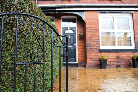 Exterior Victorian terraced house with metal front gate