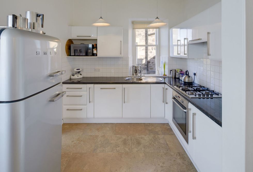 White fitted kitchen in Wormit House, Fife, Scotland