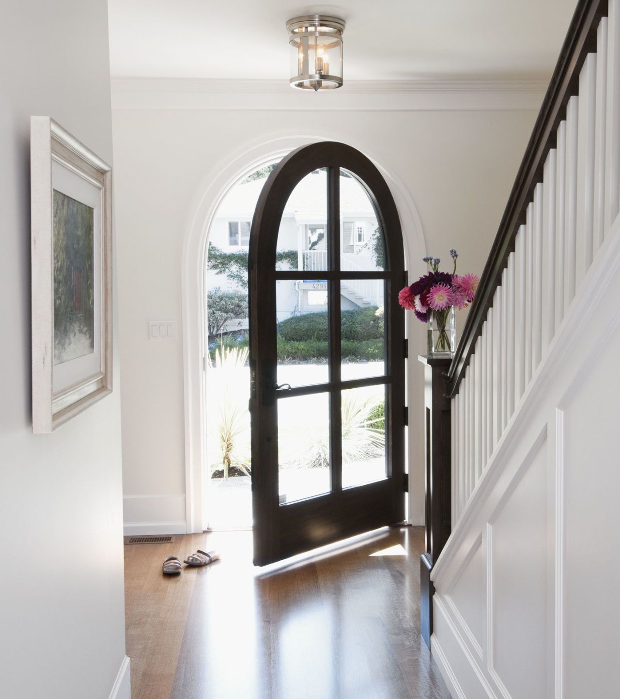 An Arched Doorway Opens To Hallway