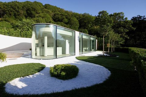 Glass villa in Switzerland designed by the famous Milanese architect, Jacopo Mascheroni