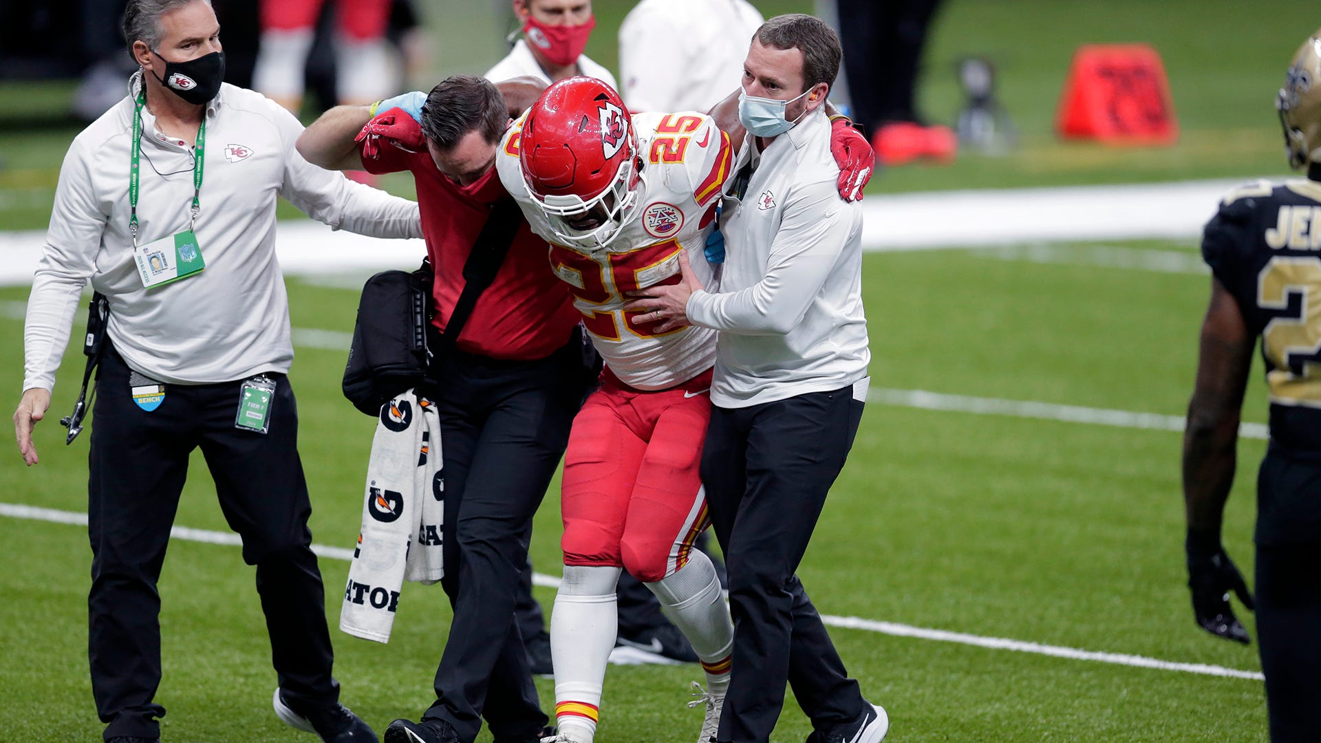 Kansas City Chiefs running back Clyde Edwards-Helaire, right, runs