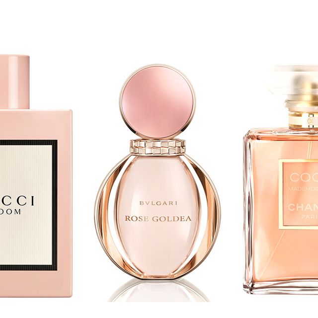 Perfume, Product, Pink, Cosmetics, Glass bottle, Peach, Water, Fluid, Liquid, Material property, 