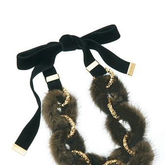 Textile, Costume accessory, Fur, Natural material, Knot, Strap, Pet supply, Tail, Thread, 