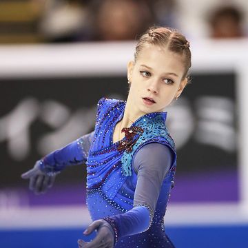 Ice skating, Figure skating, Figure skate, Skating, Recreation, Leotard, Electric blue, Ice dancing, Sports, Axel jump, 