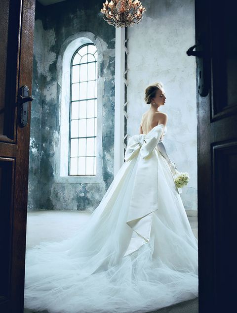 Wedding dress, Gown, Bride, Dress, Clothing, Bridal clothing, Photograph, White, Shoulder, Bridal party dress, 