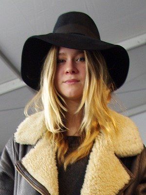 Clothing, Lip, Hat, Brown, Hairstyle, Textile, Outerwear, Style, Jacket, Sun hat, 