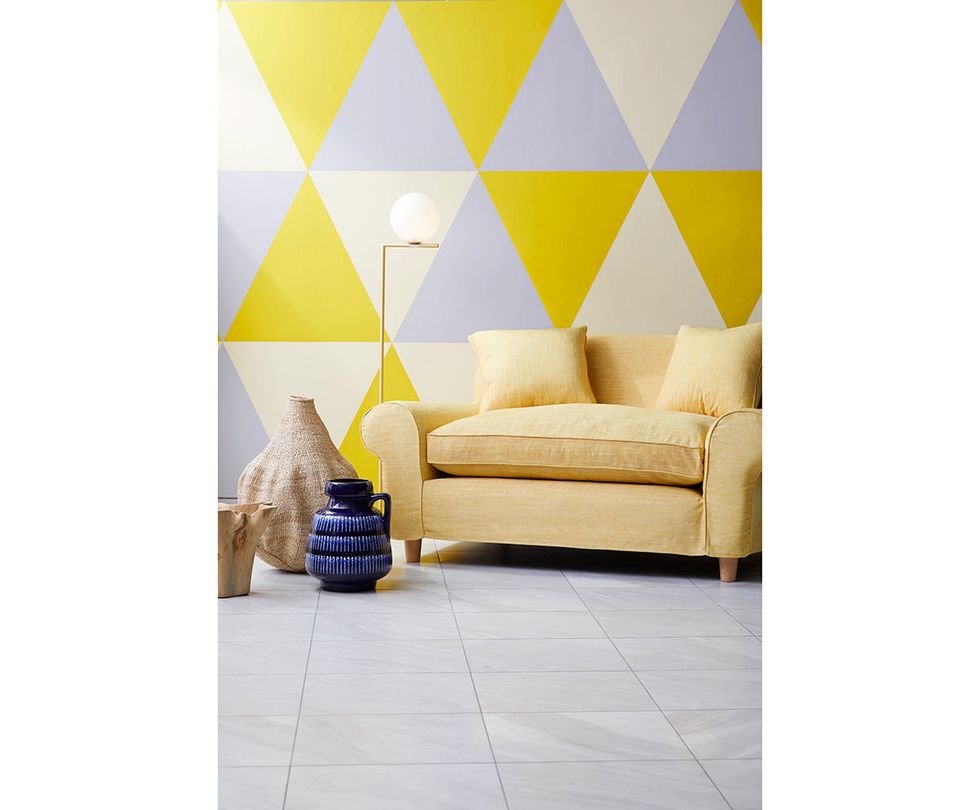 Yellow, Wall, Room, Furniture, Wallpaper, Interior design, Beige, Floor, Table, Triangle, 