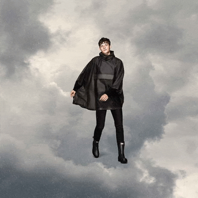 Sky, Outerwear, Standing, Fashion, Coat, Photography, Jacket, Fictional character, Cloud, Leather, 