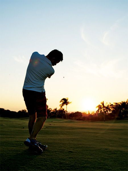 Shoe, Sports equipment, Elbow, Human leg, Standing, Golf course, Ball game, Golfer, Golf club, Shorts, 