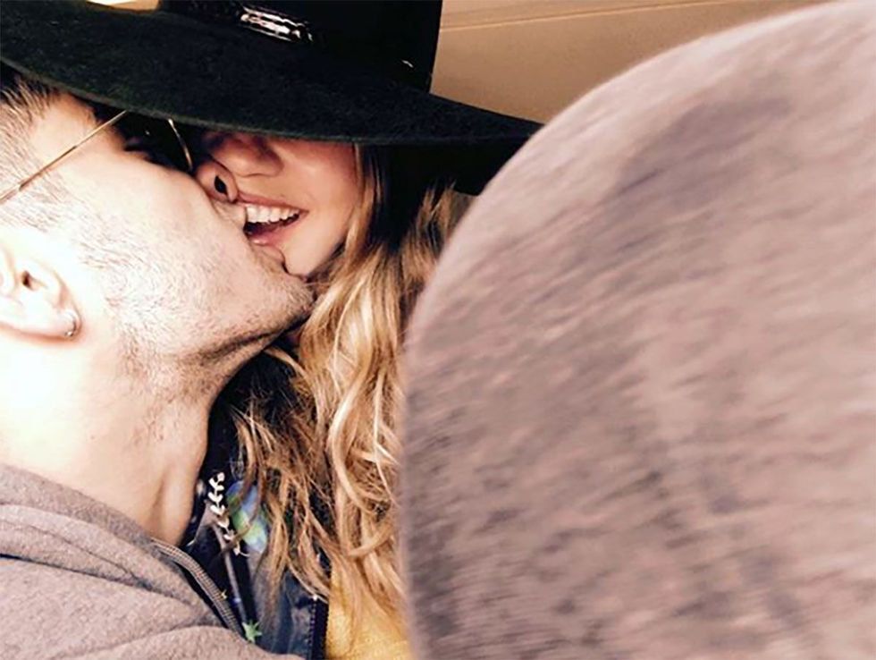Cowboy hat, Love, Interaction, Hat, Smile, Lip, Headgear, Kiss, Fun, Fashion accessory, 