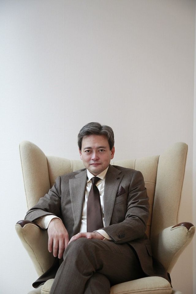Sitting, Suit, Businessperson, White-collar worker, Formal wear, Photography, Furniture, Stock photography, Chair, 