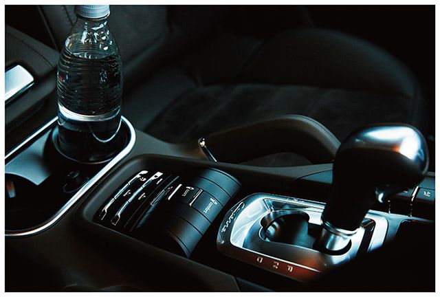 Automotive design, Glass, Gear shift, Automotive mirror, Luxury vehicle, Personal luxury car, Motorcycle accessories, Steering wheel, Center console, Still life photography, 