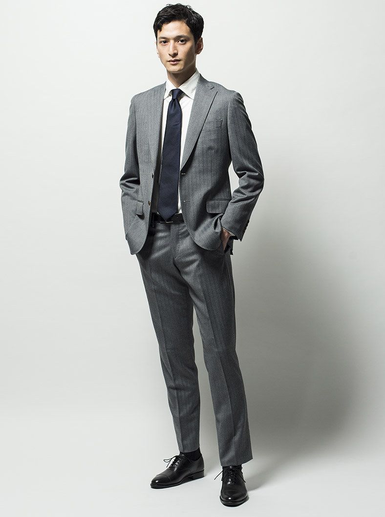 Suit, Clothing, Formal wear, Standing, Blazer, Tuxedo, White-collar worker, Outerwear, Human, Suit trousers, 