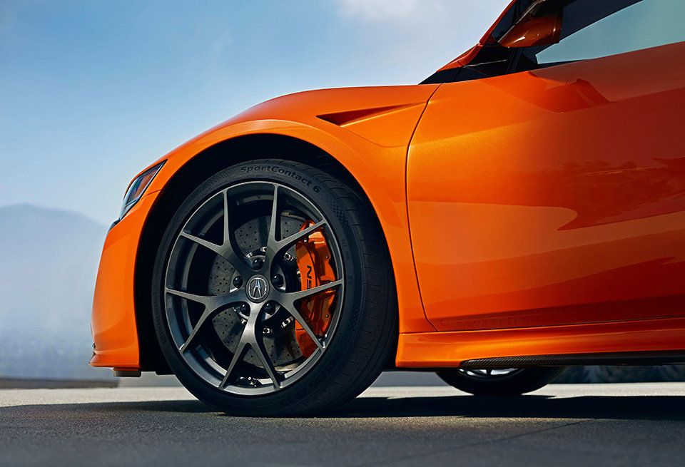 Land vehicle, Vehicle, Alloy wheel, Car, Wheel, Automotive design, Rim, Sports car, Orange, Supercar, 