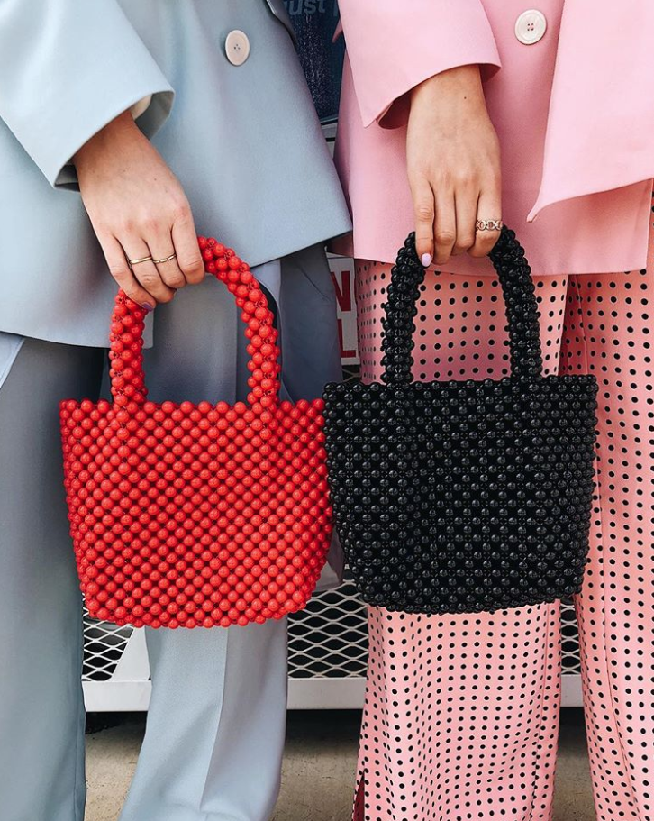 Red, Handbag, Pattern, Design, Street fashion, Bag, Hand, Fashion accessory, Polka dot, Pattern, 