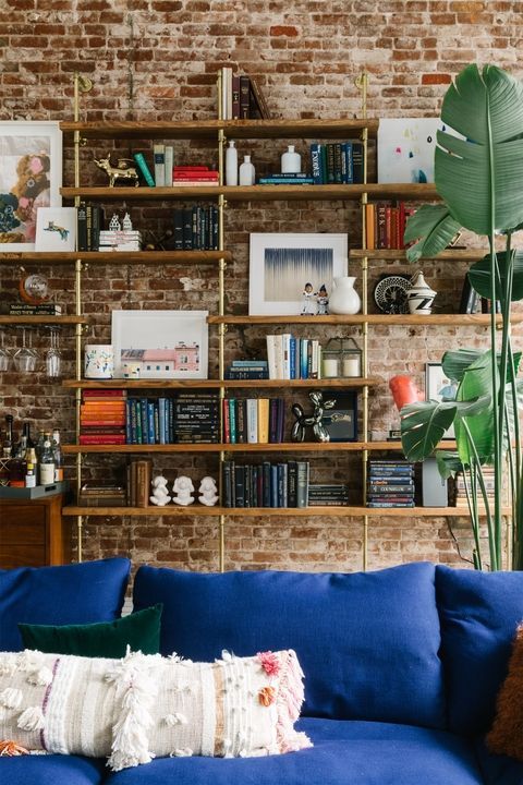 Blue, Living room, Couch, Room, Green, Wall, Shelf, Furniture, Home, Shelving, 