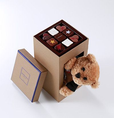 Brown, Toy, Teddy bear, Stuffed toy, Rectangle, Box, Square, Still life photography, Packaging and labeling, Bear, 