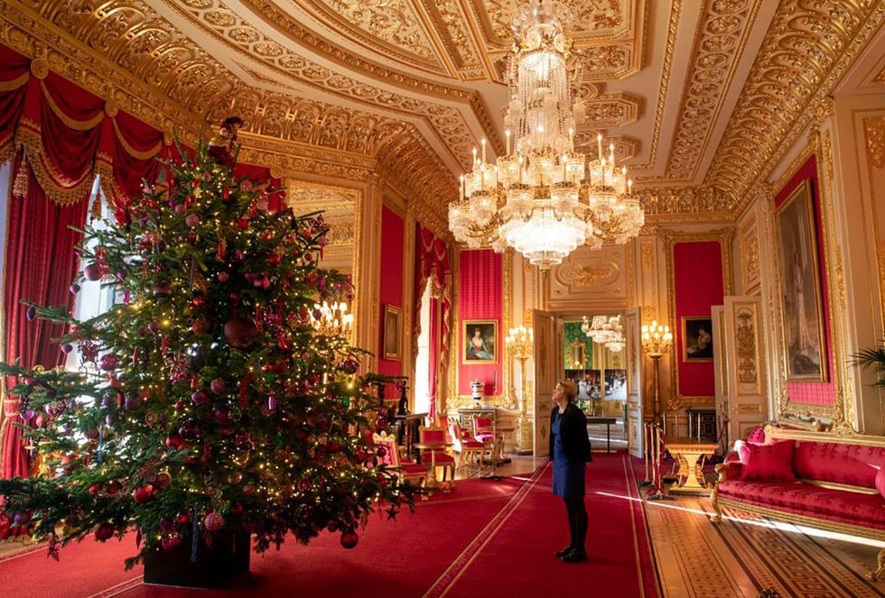 Red, Christmas, Building, Tree, Christmas decoration, Lighting, Room, Architecture, Interior design, Lobby, 