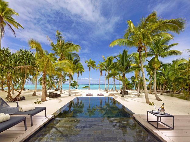Resort, Swimming pool, Property, Vacation, Tree, Palm tree, Caribbean, Sky, Tropics, Real estate, 