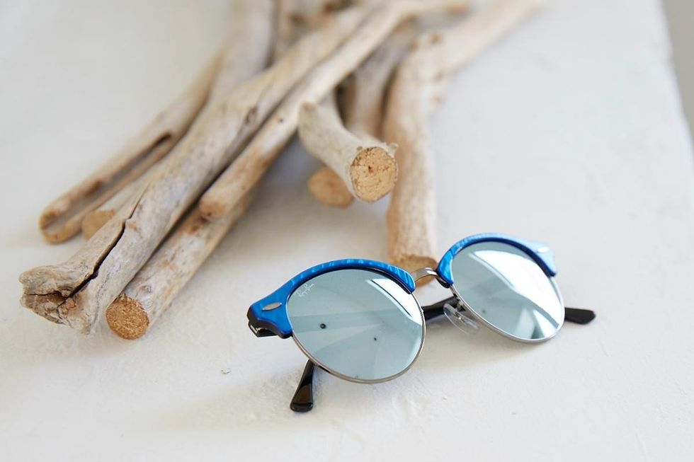 Eyewear, Vision care, Wood, Natural material, Eye glass accessory, Beige, Circle, Still life photography, Bone, 