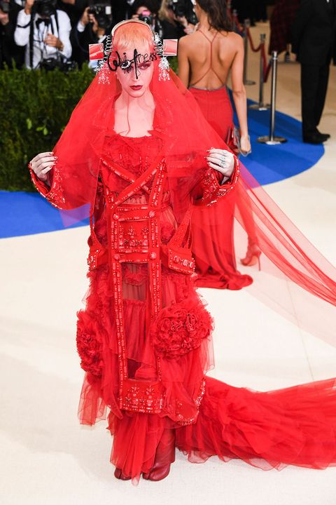 Red, Fashion, Red carpet, Shoulder, Haute couture, Dress, Carpet, Flooring, Event, Joint, 