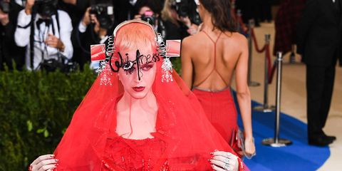 Red, Fashion, Red carpet, Shoulder, Haute couture, Dress, Carpet, Flooring, Event, Joint, 
