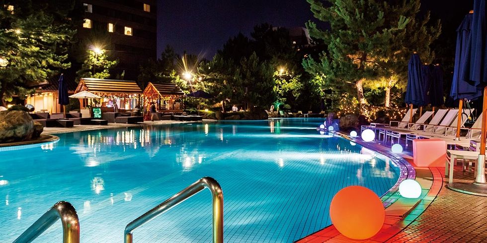 Swimming pool, Leisure, Resort, Lighting, Resort town, Vacation, Night, Hotel, Building, Fun, 