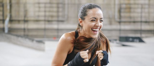 Facial expression, Arm, Physical fitness, Muscle, Boxing glove, Smile, Undergarment, Sports bra, Individual sports, Abdomen, 