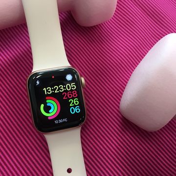 Wrist, Pink, Watch, Finger, Material property, Nail, Font, Watch phone, Technology, Electronic device, 