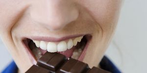 Chocolate, Chocolate bar, Mouth, Sweetness, Tooth, Food, Close-up, Smile, Confectionery, 