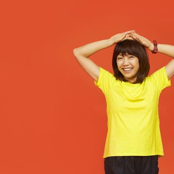 Yellow, Orange, Shoulder, Arm, T-shirt, Standing, Neck, Joint, Gesture, Human body, 