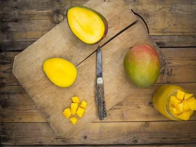 Meyer lemon, Food, Yellow, Lemon, Fruit, Mango, Still life photography, Cutting board, Plant, Wood, 