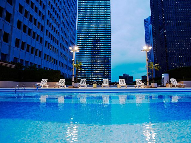 Swimming pool, Blue, Building, Sky, Architecture, Property, Metropolitan area, City, Human settlement, Condominium, 