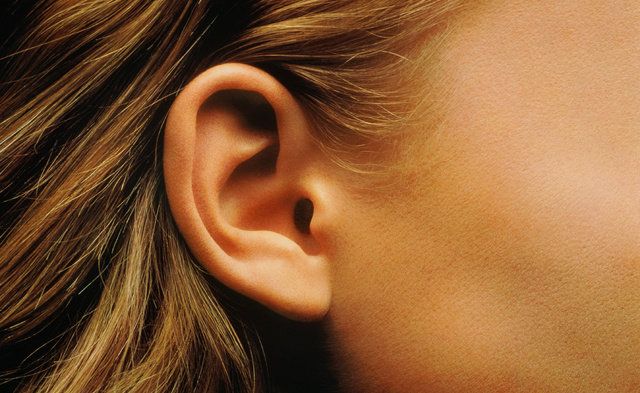 Ear, Hair, Face, Earrings, Organ, Close-up, Chin, Hearing, Body piercing, Neck, 
