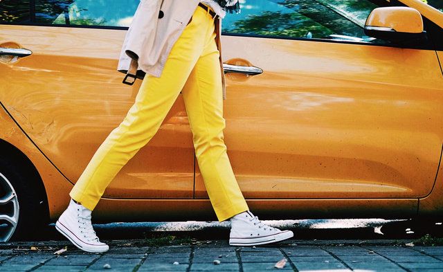 Yellow, Clothing, Vehicle door, Street fashion, Waist, Leg, Outerwear, Jeans, Vehicle, Trousers, 