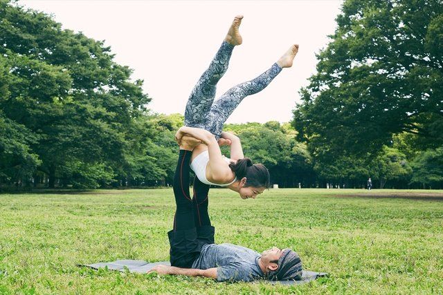 People in nature, Green, Physical fitness, Grass, Arm, Yoga, Tree, Hand, Leg, Flip (acrobatic), 