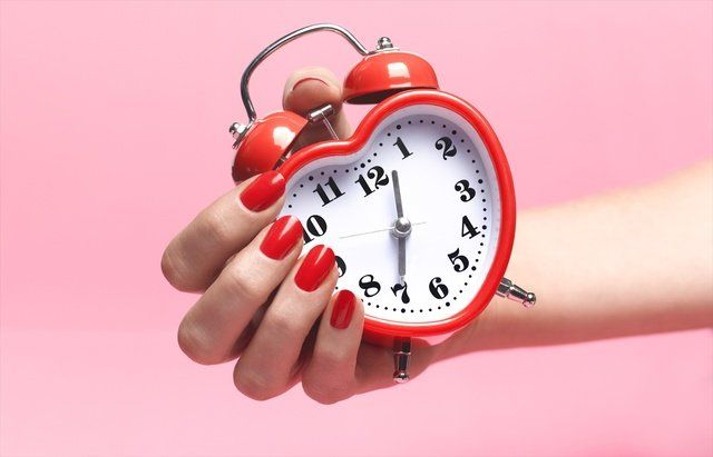 Alarm clock, Clock, Analog watch, Red, Watch, Finger, Stopwatch, Home accessories, Hand, Material property, 